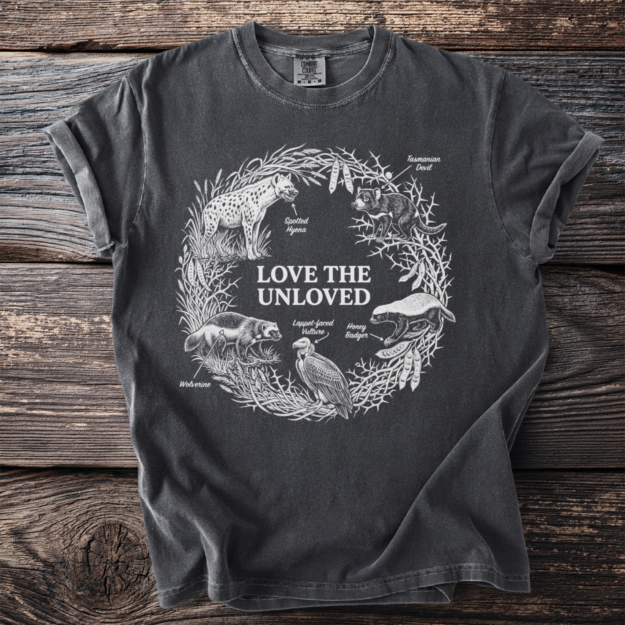 Dark grey t-shirt with "Love the Unloved" text and illustrations of animals.