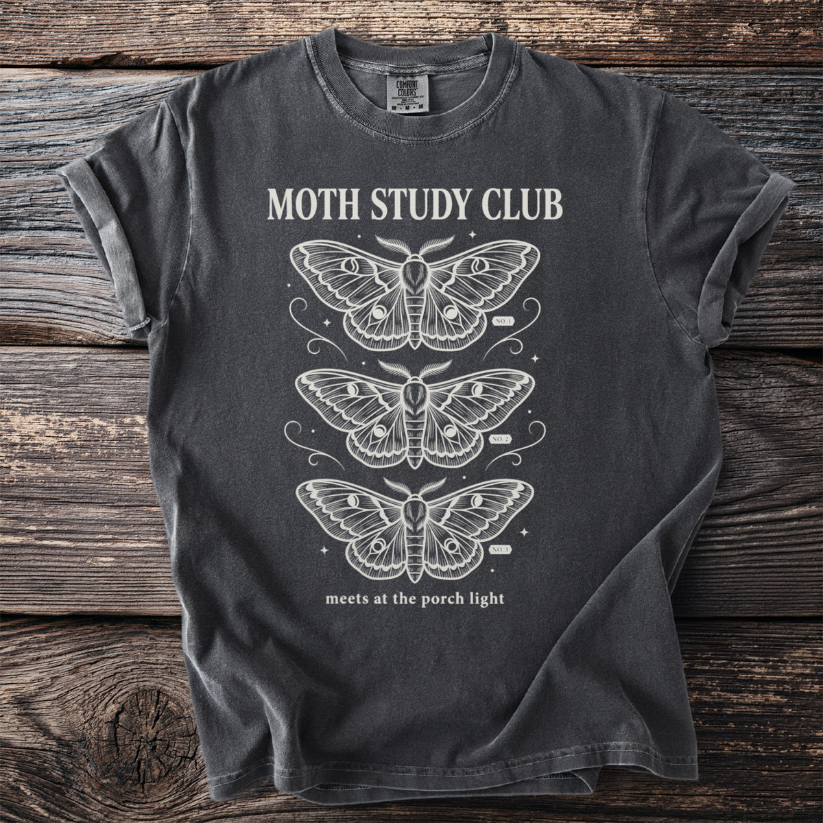 Dark gray t-shirt with white moths and "MOTH STUDY CLUB" text.