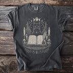 Black cat with occult symbols, moons, candles, and an open book.
