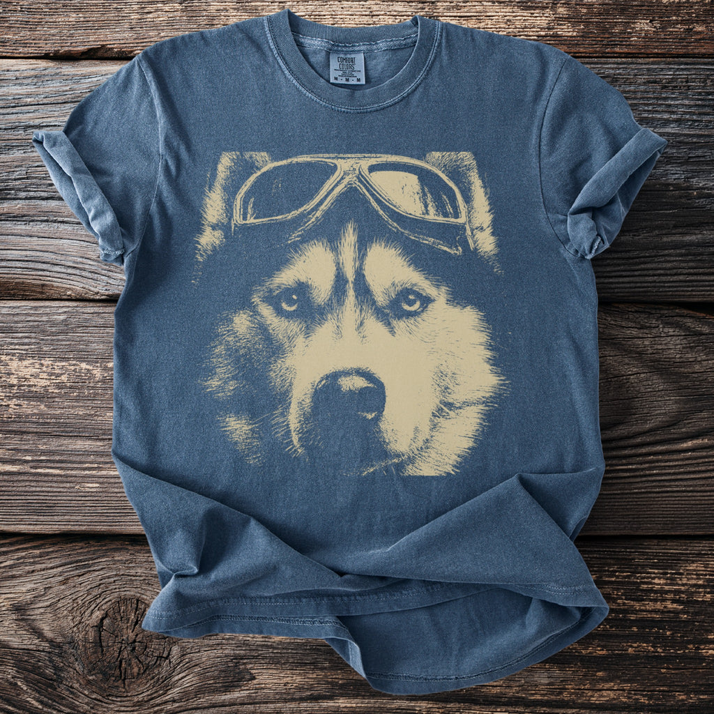 Blue t-shirt with a tan graphic of a husky wearing pilot goggles.