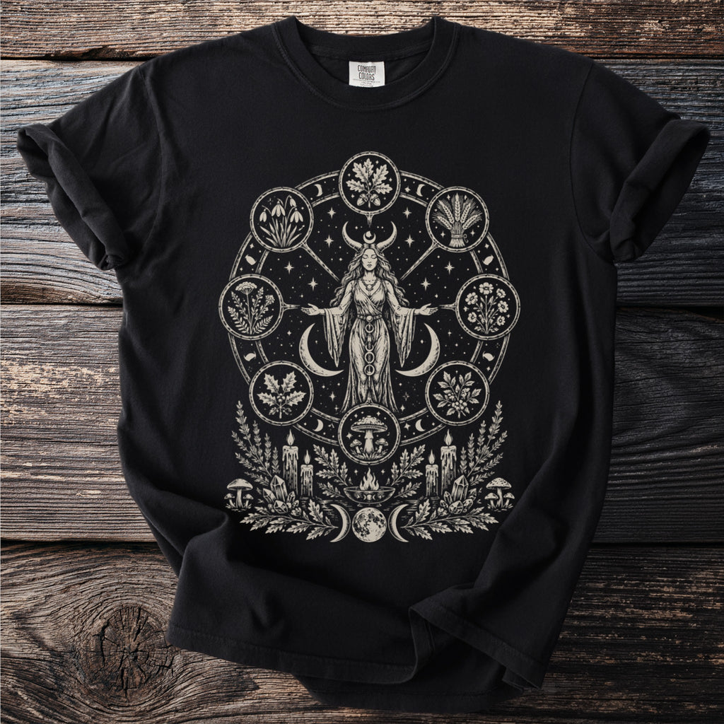 Black t-shirt with witchy circular graphic of nature symbols and moon phases.