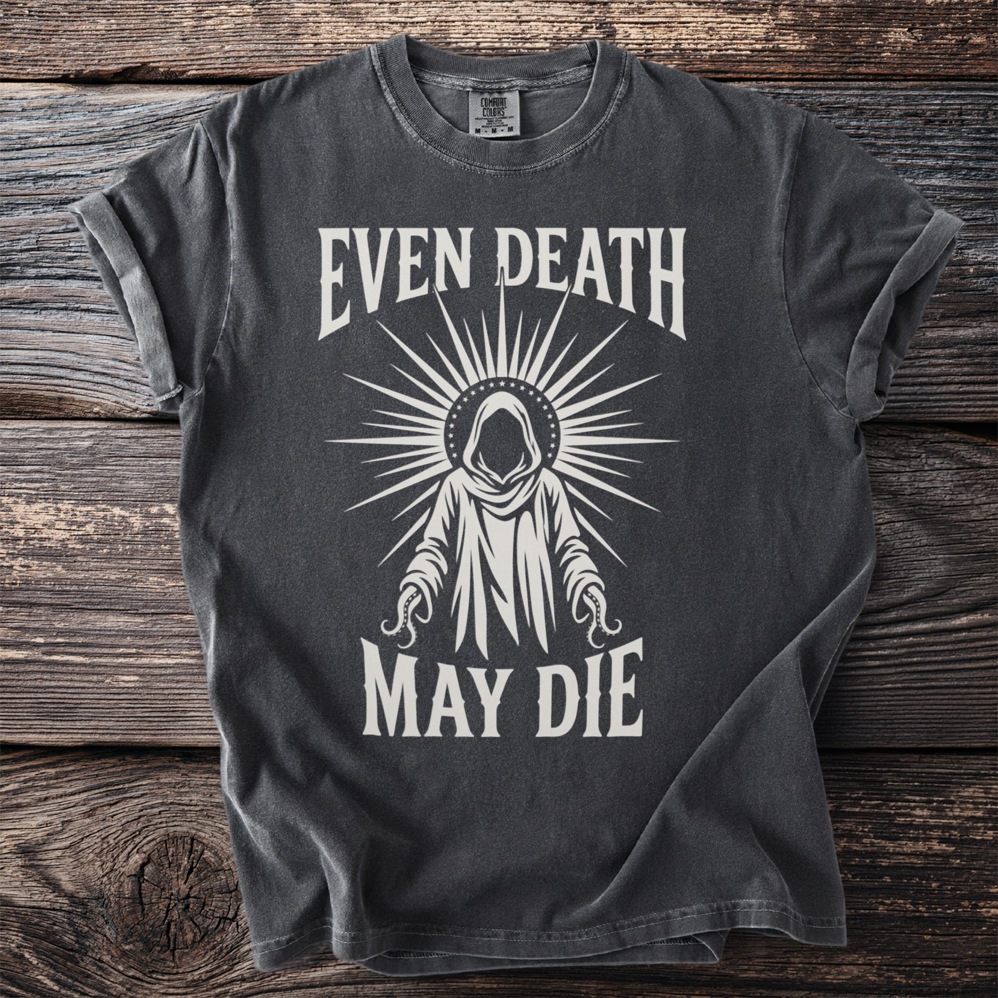Dark t-shirt with white graphic: "EVEN DEATH MAY DIE" and a hooded figure.