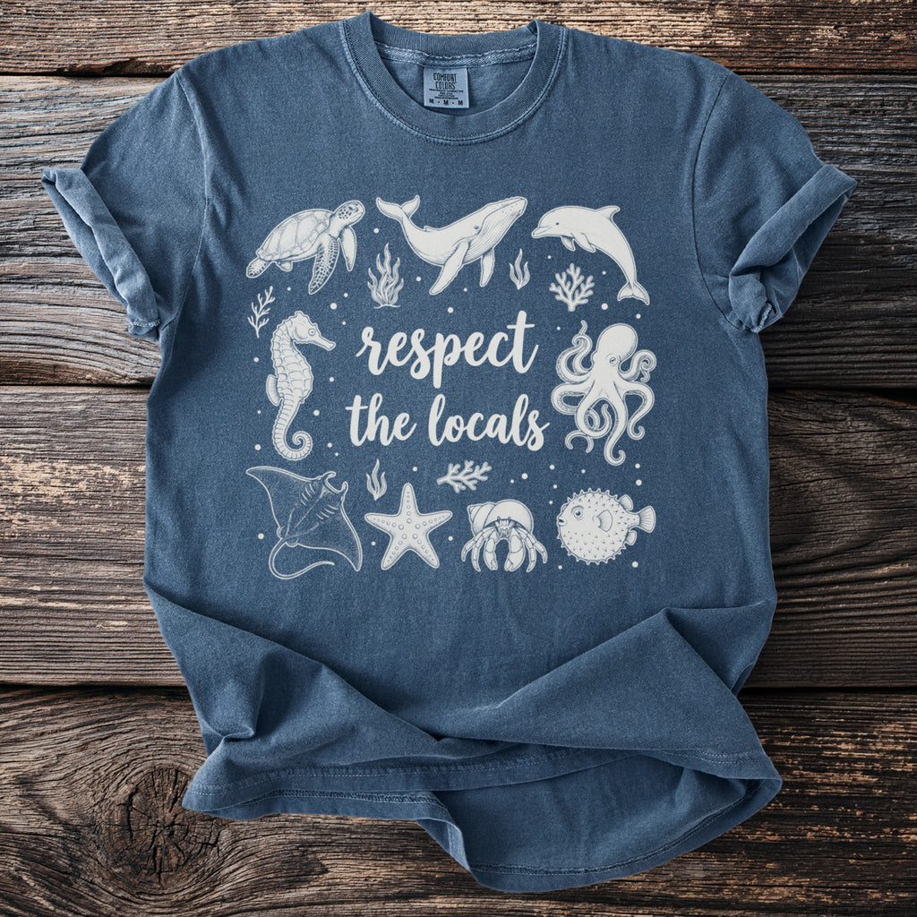 Short sleeve t-shirt with white line art of marine animals and text "respect the locals".