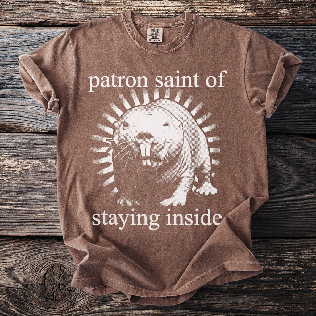 Brown t-shirt with naked mole rat graphic and text "patron saint of staying inside."