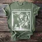 Green t-shirt with text "i cannot do this today" and werewolf with kitten graphic.