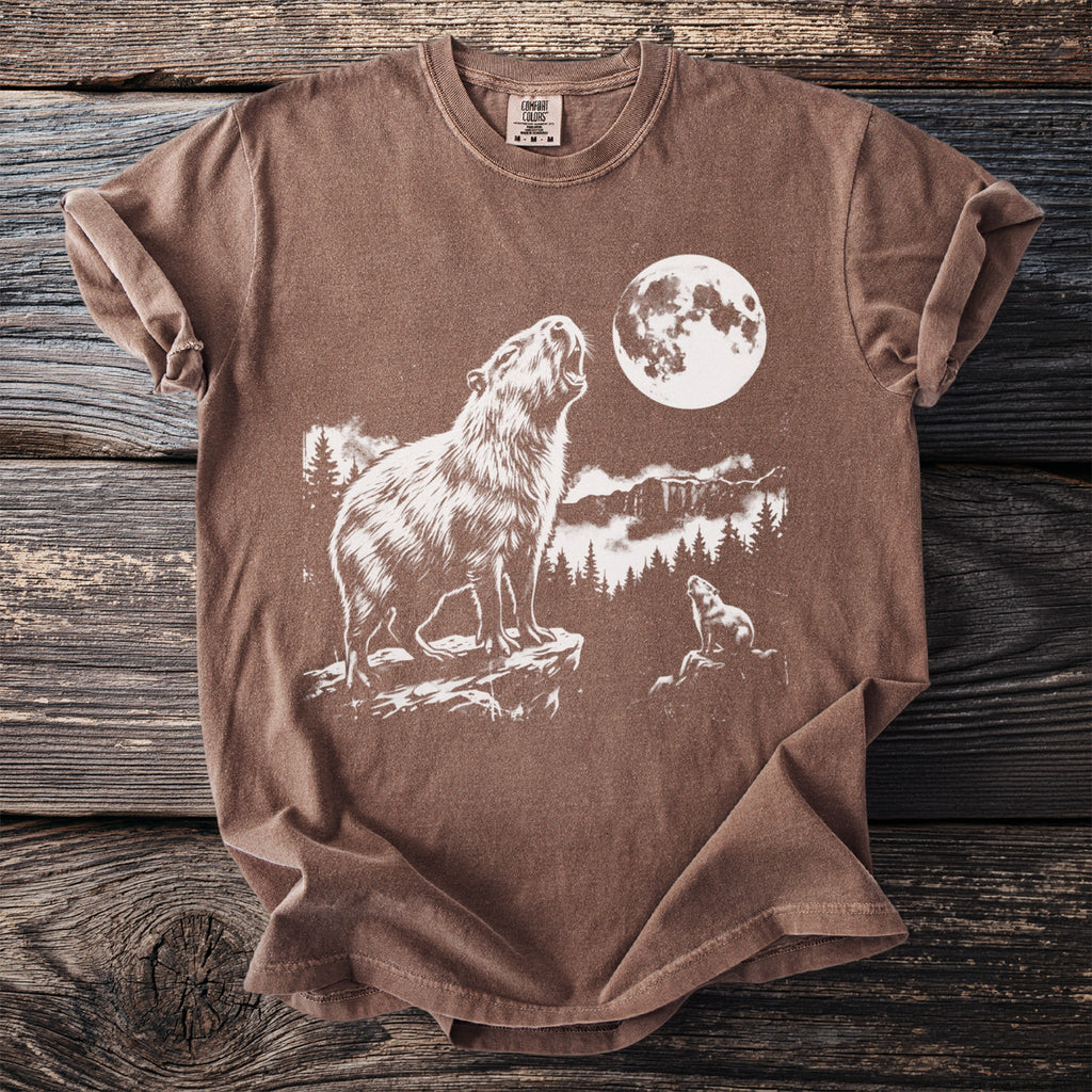 Brown t-shirt with a white graphic of two capybaras howling at a moon.