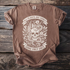 Brown t-shirt with skull, snake, and plants graphic and text "ALL PLANTS ARE EDIBLE SOME ONLY ONCE".