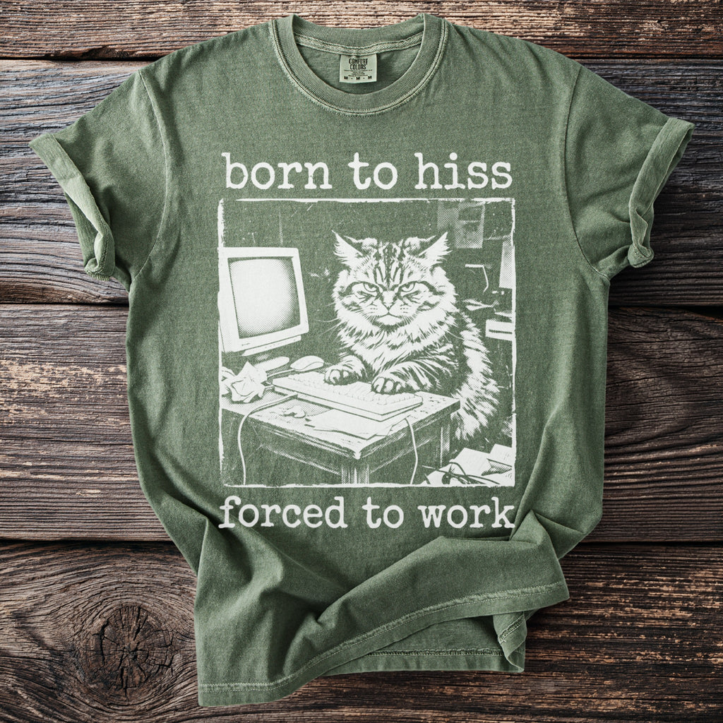 Green t-shirt with a print of a cat at a computer and the text "born to hiss forced to work".