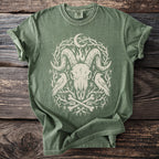 Green t-shirt with ram skull, ravens, bones, runes, and crescent moon graphic.