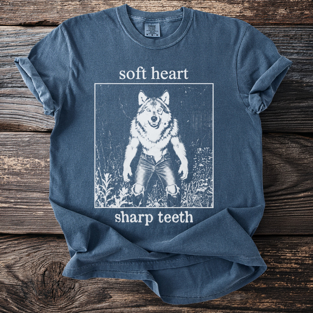 Blue t-shirt with "soft heart sharp teeth" text and a werewolf graphic.