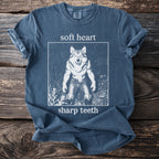 Blue t-shirt with "soft heart sharp teeth" text and a werewolf graphic.