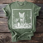 Green t-shirt with a distressed graphic of three cats, a tin can, and an ashtray.