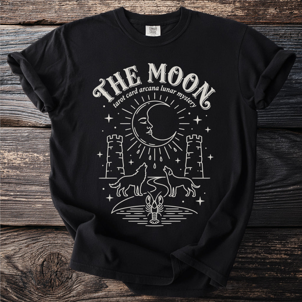 Black t-shirt with "The Moon tarot card arcana lunar mystery" and celestial design.