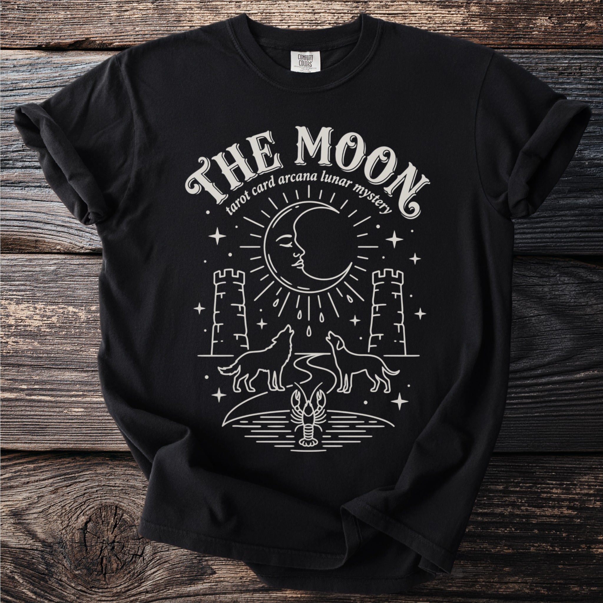 Black t-shirt with "The Moon tarot card arcana lunar mystery" and celestial design.