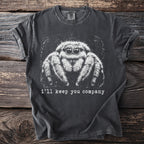 Dark gray t-shirt with white graphic of a jumping spider and text "i'll keep you company".
