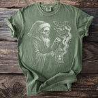 Green t-shirt with a drawing of a skeleton grim reaper holding a lantern.