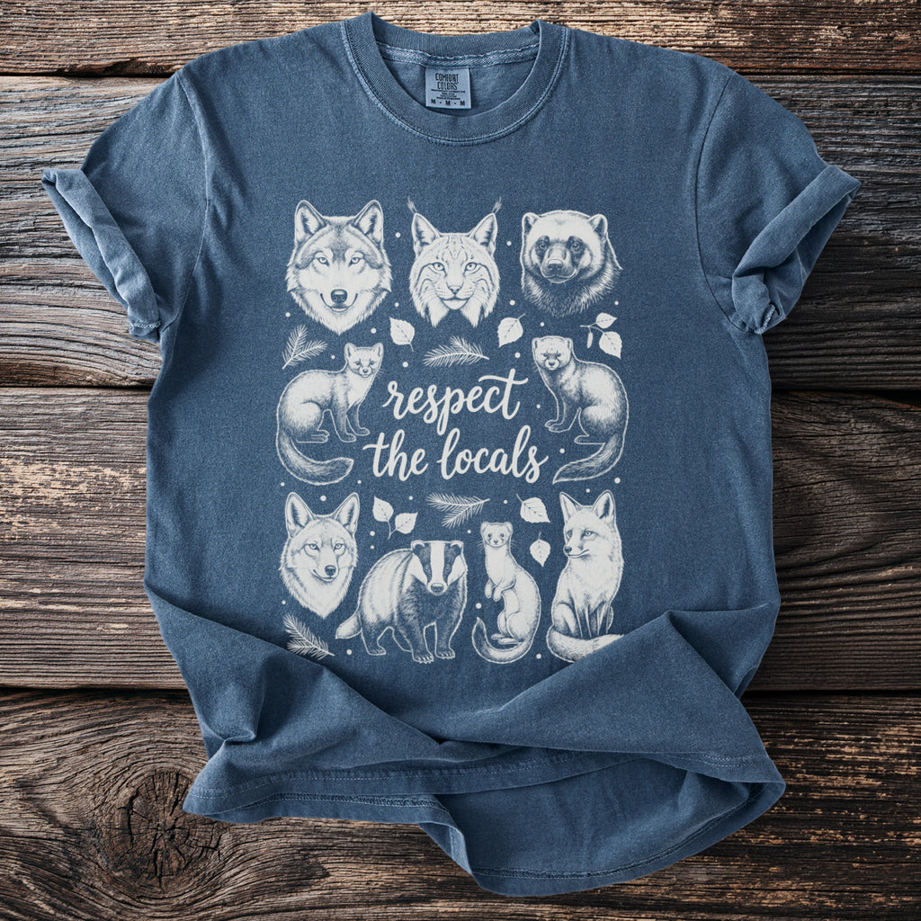 T-shirt with sketch art of wolf, bobcat, wolverine, foxes, badger, and weasels forming "respect the locals".