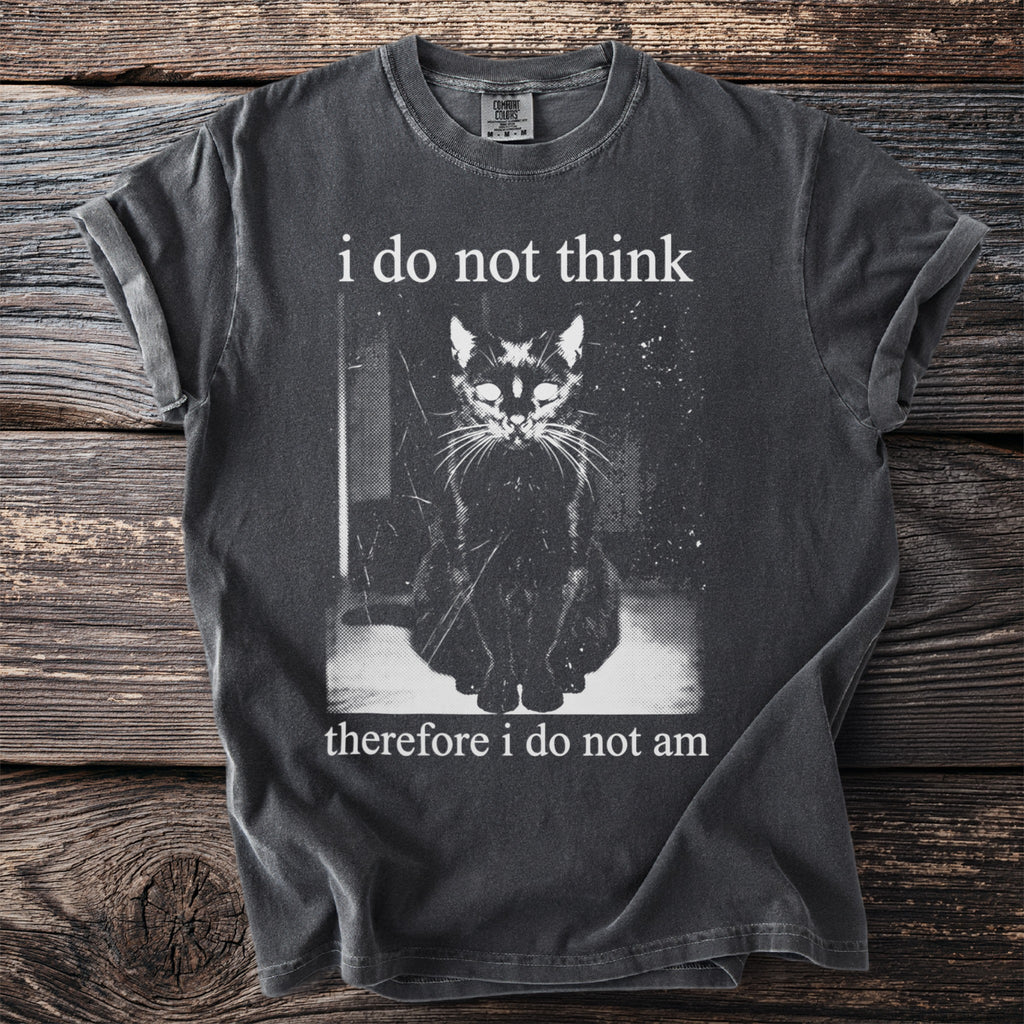 Dark t-shirt with a monochrome graphic of a seated black cat and text.