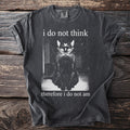 Dark t-shirt with a monochrome graphic of a seated black cat and text.