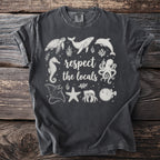 Dark grey t-shirt with white ocean animals and text "respect the locals."