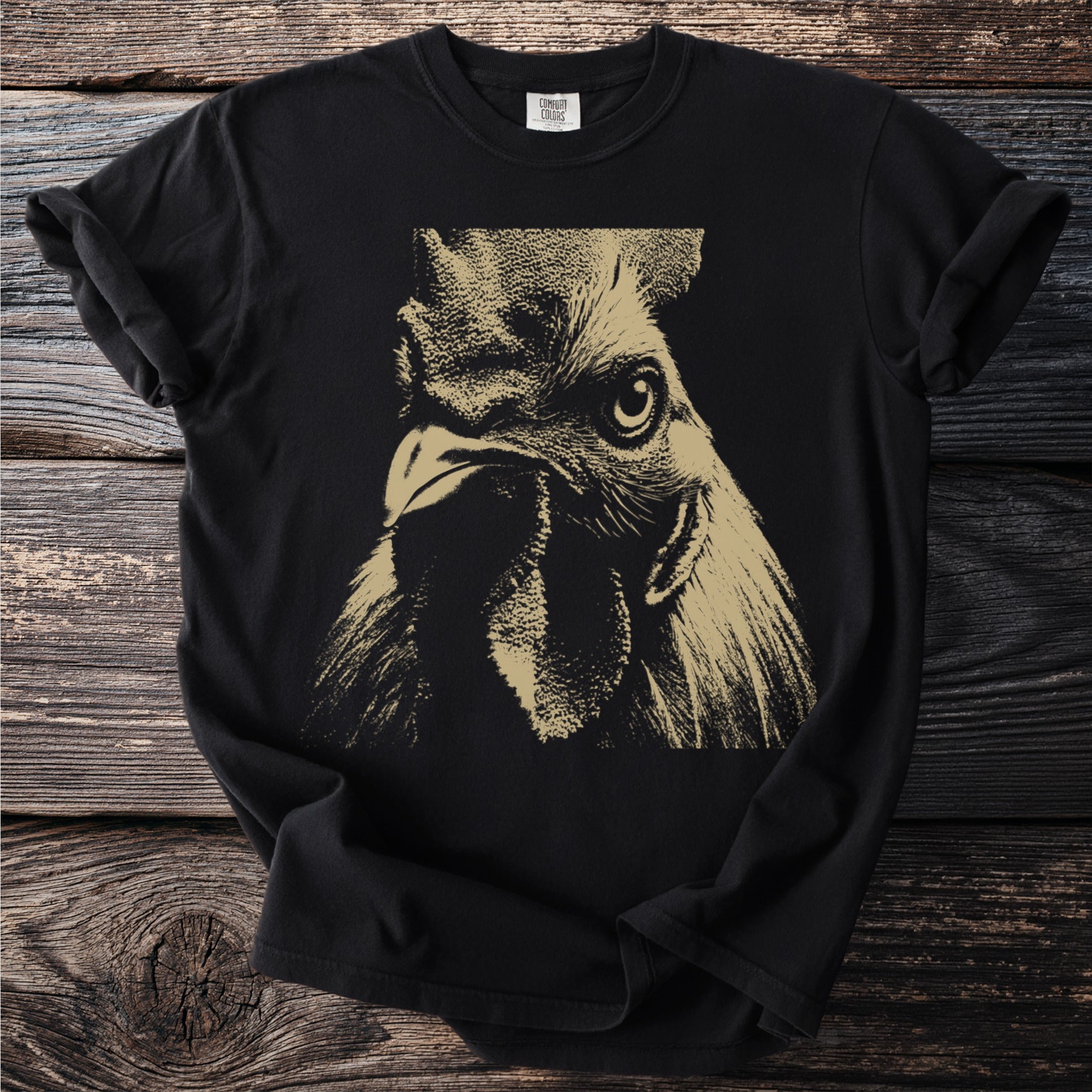Black t-shirt with a textured gold print of a rooster's head.