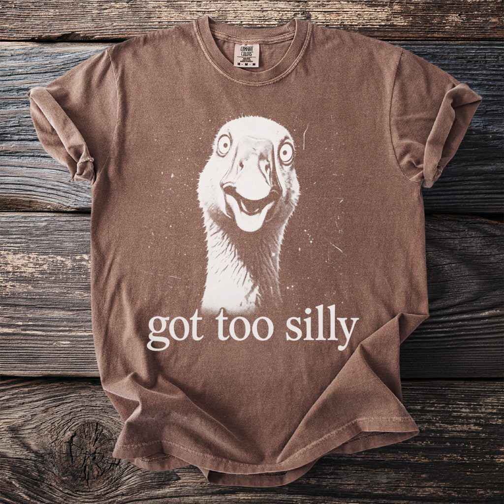 Brown t-shirt with a distressed graphic of a goose's head and text "got too silly".