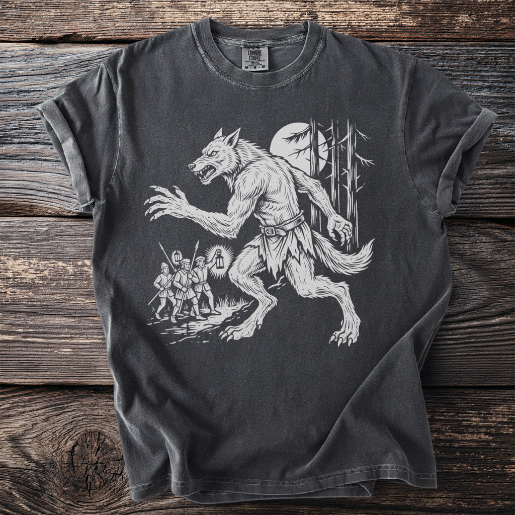 Werewolf illustration on dark gray t-shirt with moonlight and hunters.