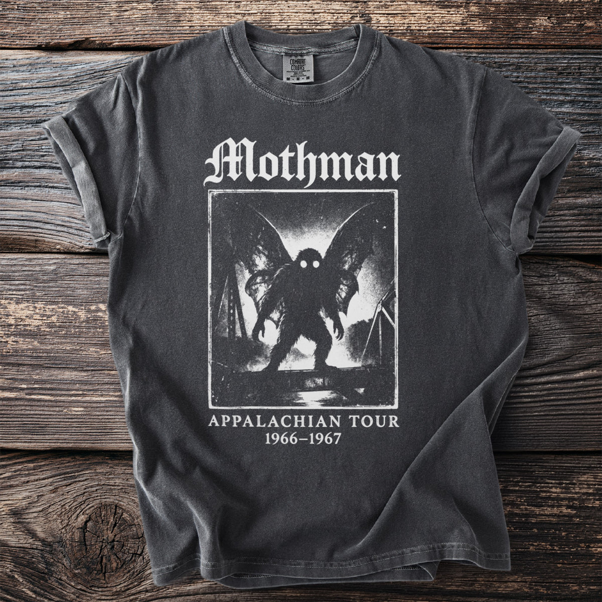 Mothman Appalachian Tour 1966-1967 graphic on a charcoal t-shirt.