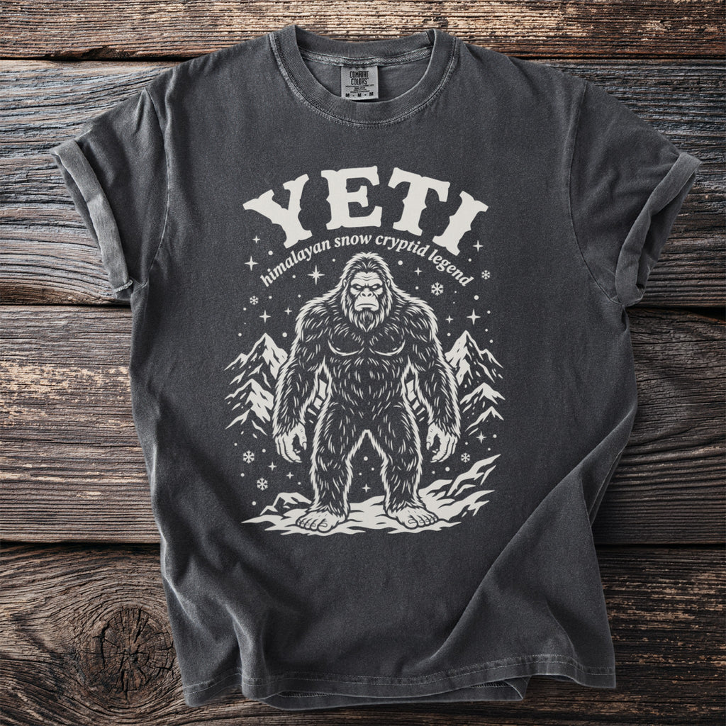 Dark grey t-shirt with Yeti illustration and "Himalayan snow cryptid legend" text.