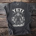Dark grey t-shirt with Yeti illustration and "Himalayan snow cryptid legend" text.