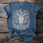 Blue t-shirt with goat skull, ravens, moon, and runes graphic.