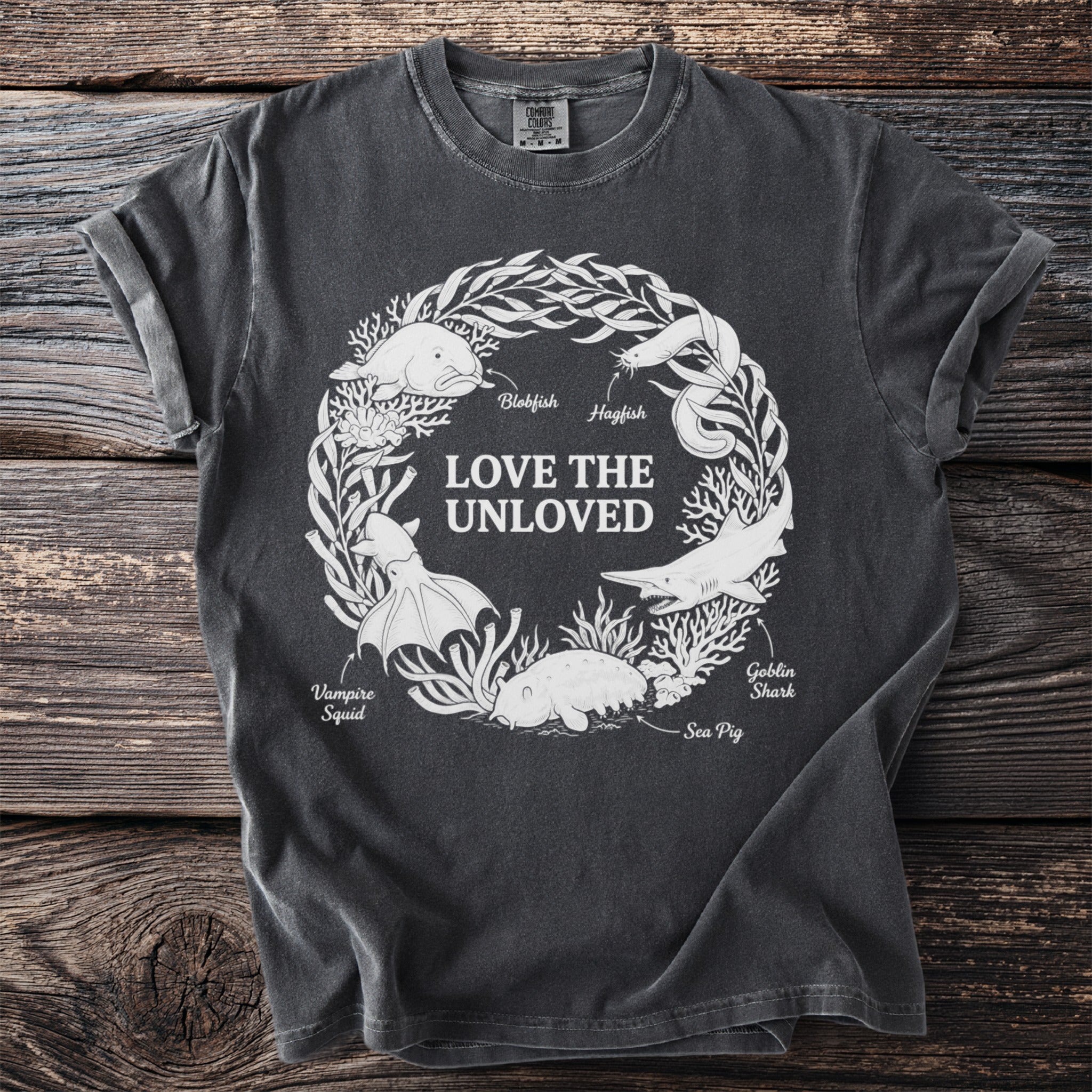 T-shirt with white graphic of unusual sea creatures and text "Love the Unloved".