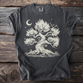 Dark t-shirt with a cream graphic of a stylized tree under a crescent moon and starry sky.