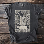 Dark t-shirt featuring a medieval-style print of a bull and a robed figure in a forest scene under the moon and stars.
