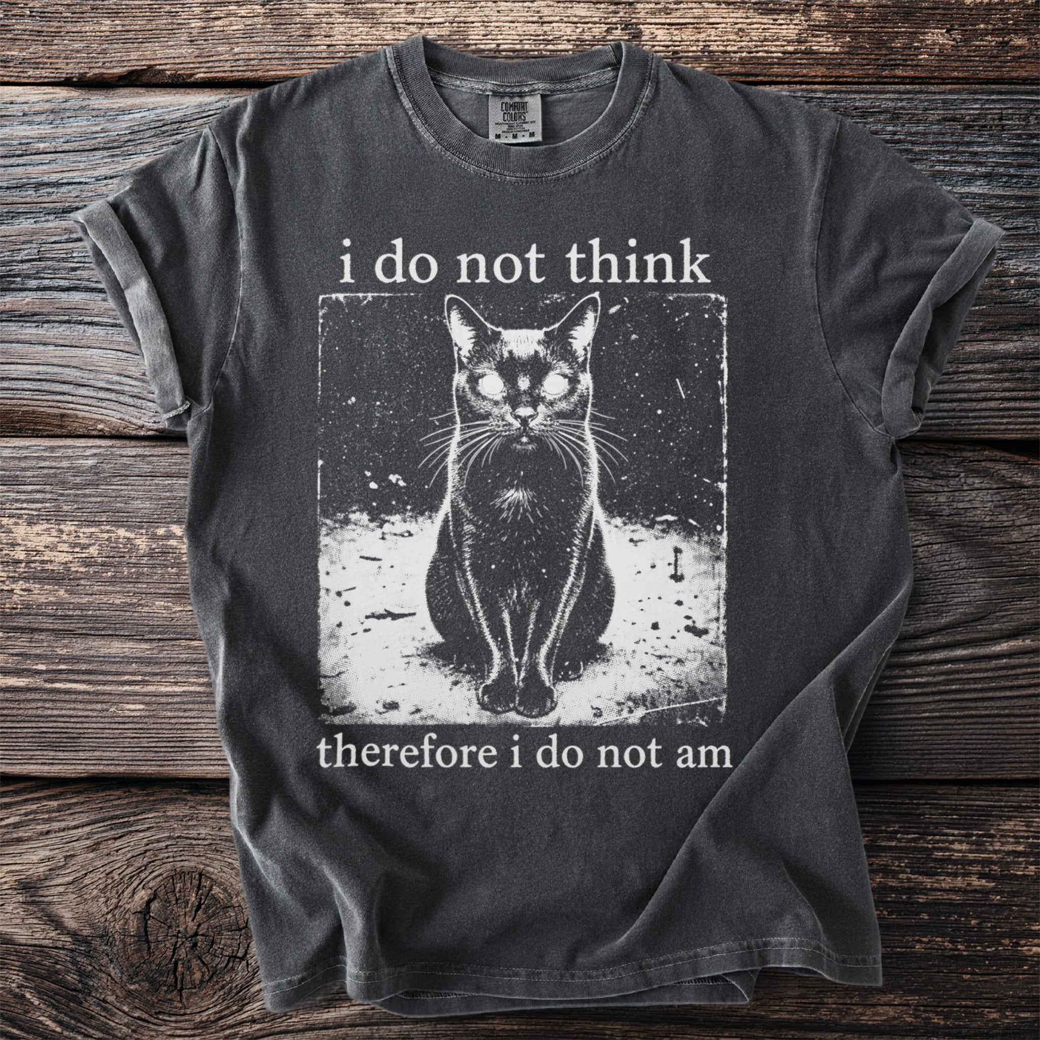 Dark grey t-shirt with printed text "i do not think therefore i do not am" and a black cat image.