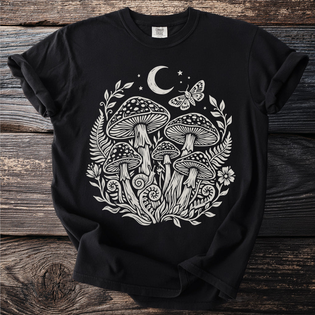 Black t-shirt with mystical mushroom, moon, moth, and botanical art graphic.