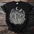Black t-shirt with mystical mushroom, moon, moth, and botanical art graphic.