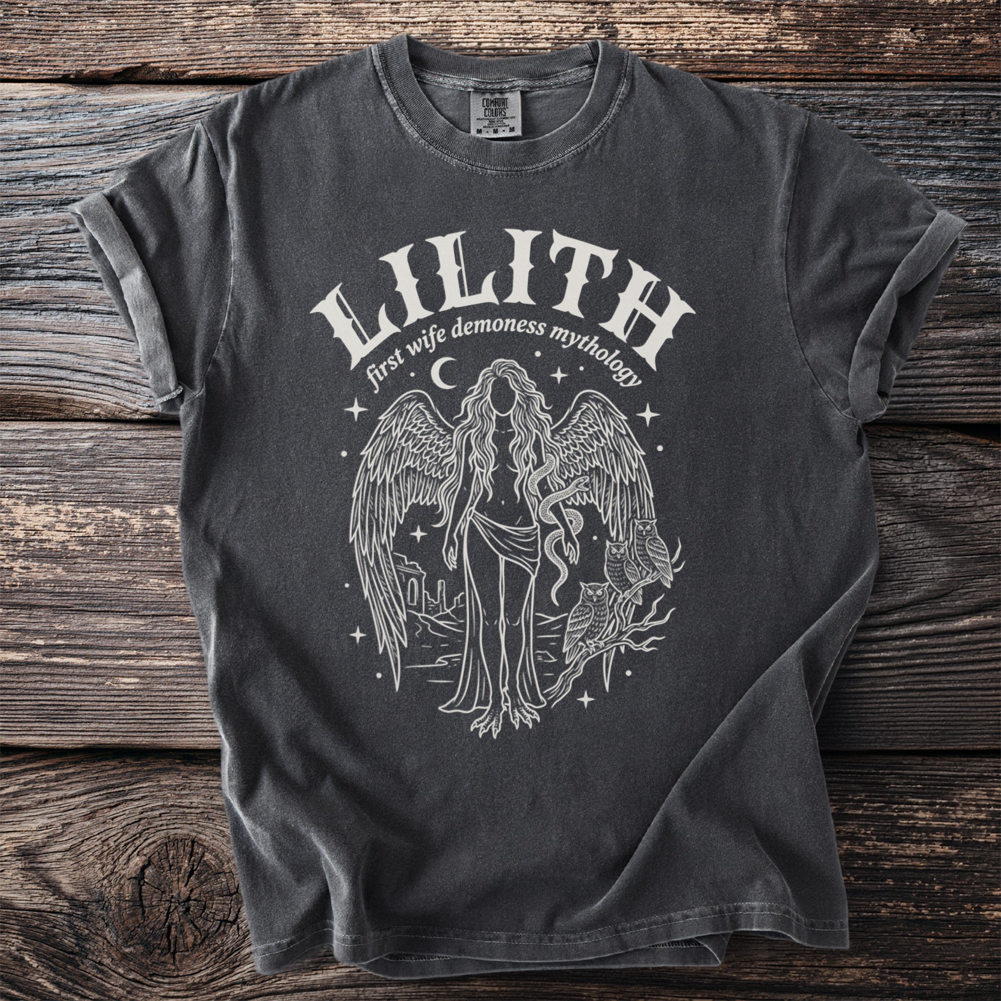 Dark grey t-shirt with white line art of Lilith, wings, owls, and stars.