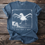Blue t-shirt with a graphic of a seagull stealing french fries and text.