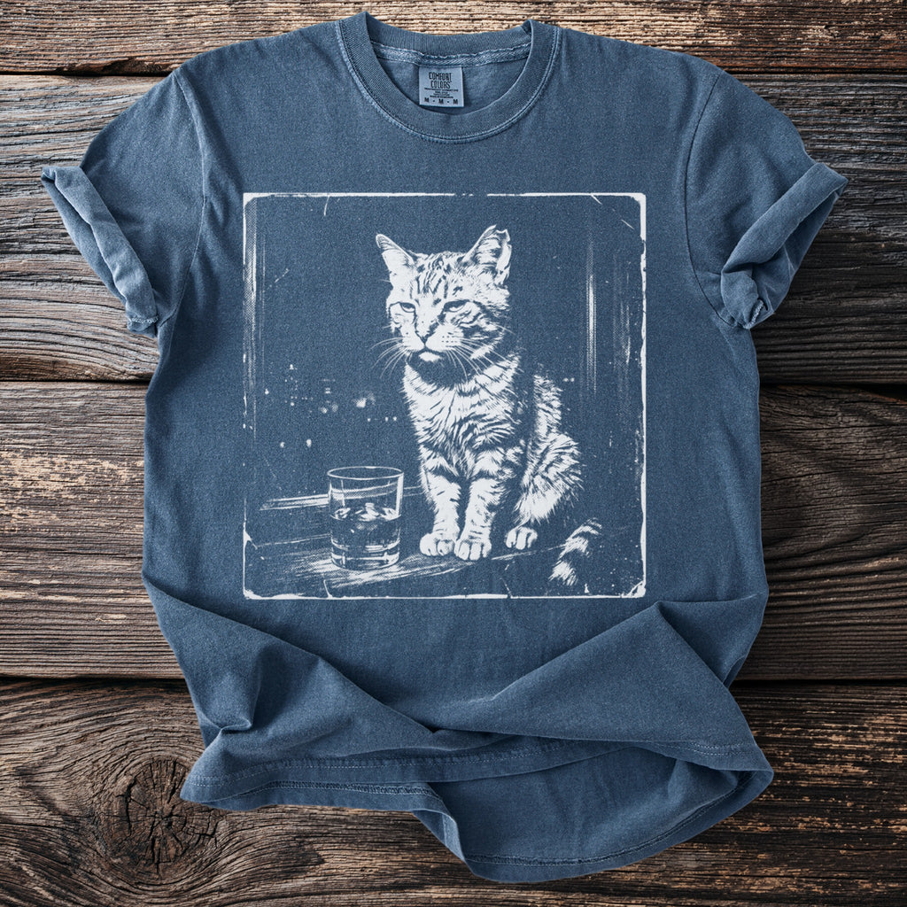 Graphic tee with a white ink sketch of a cat sitting next to a glass of ice.