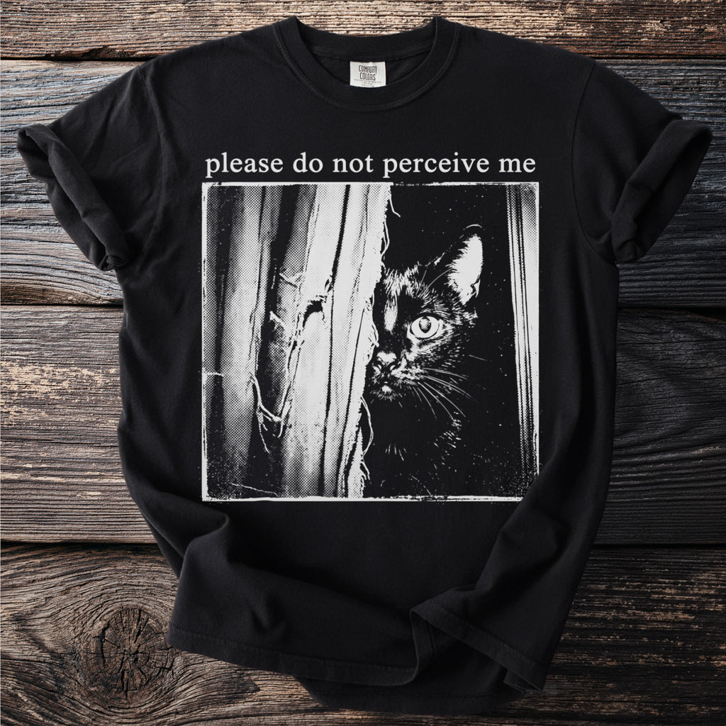 Black t-shirt with "please do not perceive me" and a peeking black cat graphic.