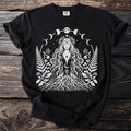Black t-shirt with white mystical woman, moon phases, stars, and botanical designs.