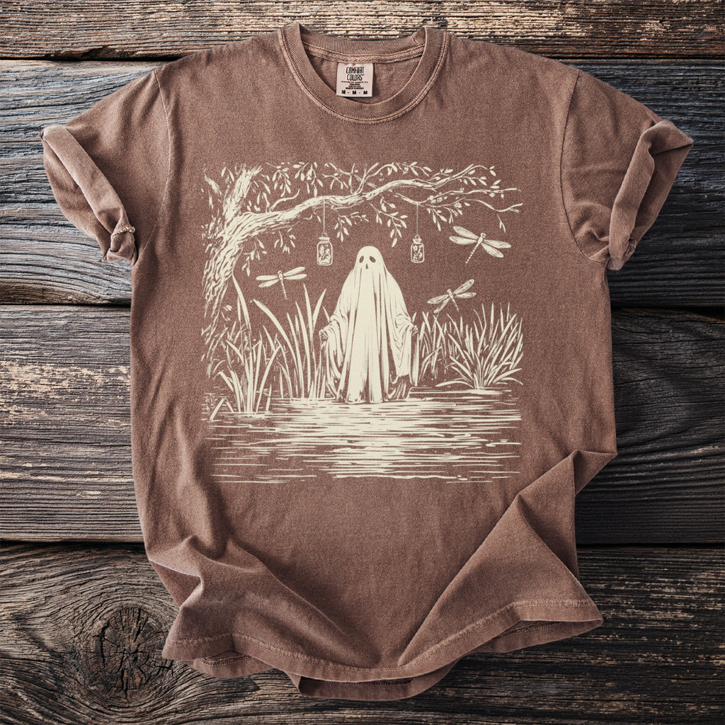 Brown t-shirt with ghost, dragonflies, and jars hanging from a tree.