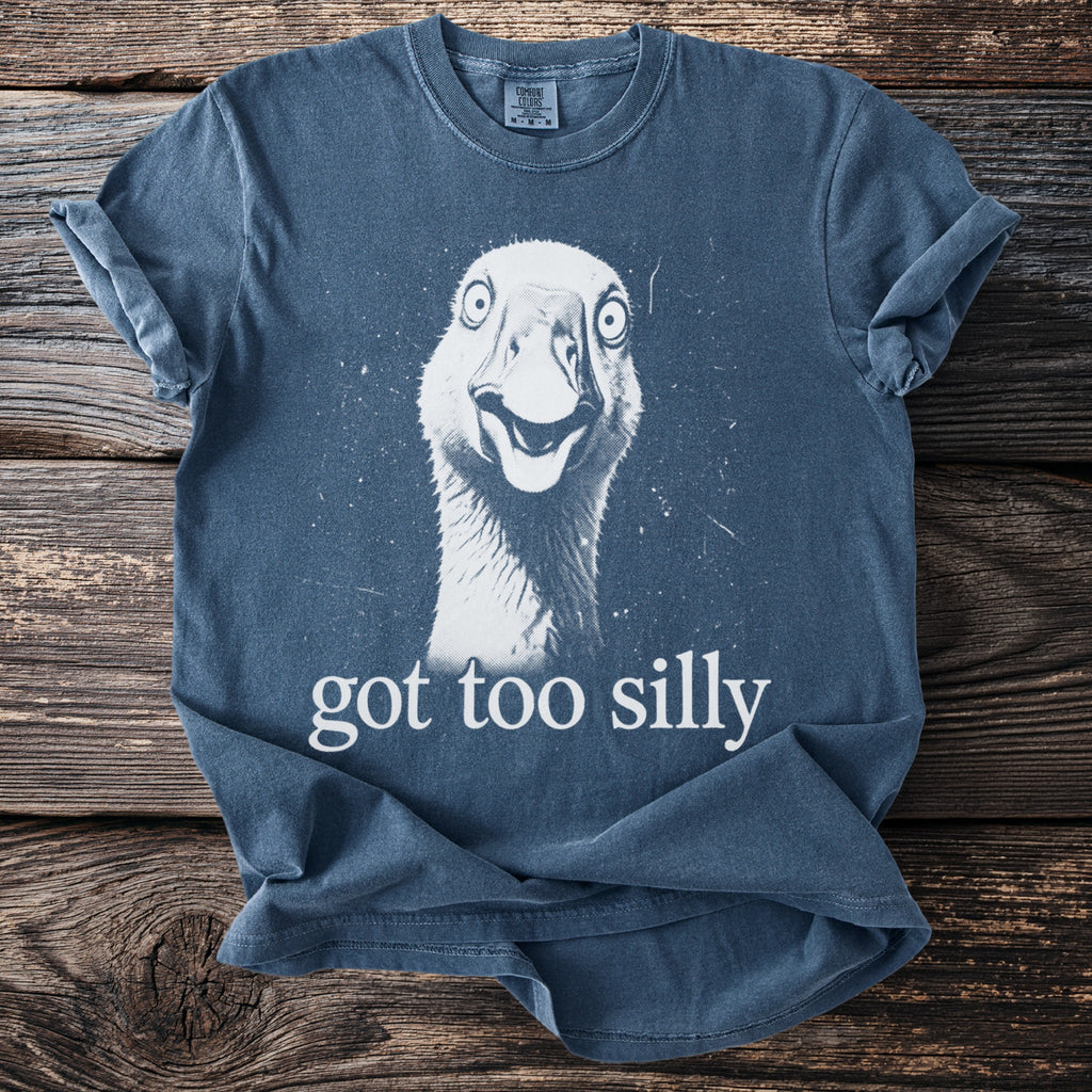 Blue t-shirt with a graphic of a goose and the text "got too silly"