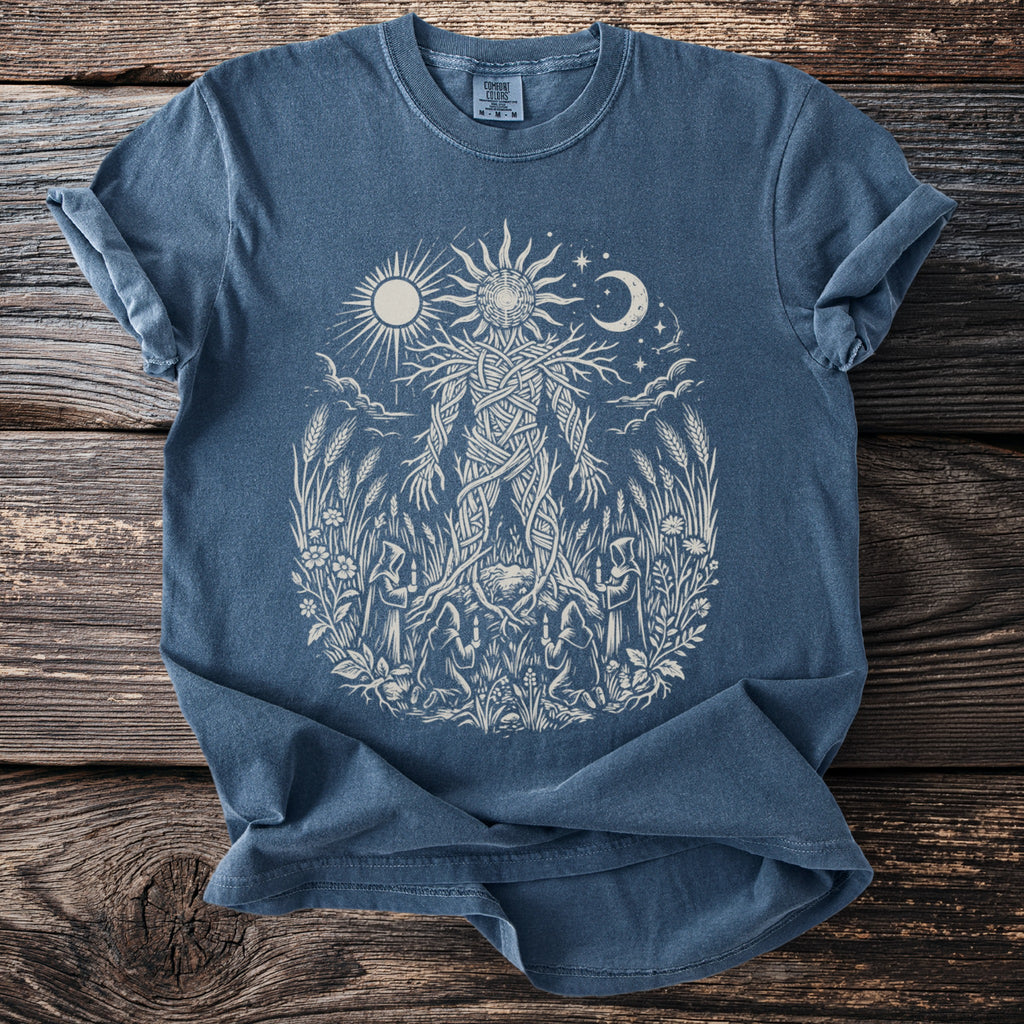Blue t-shirt with a sun, moon, stars, and a forest spirit design.