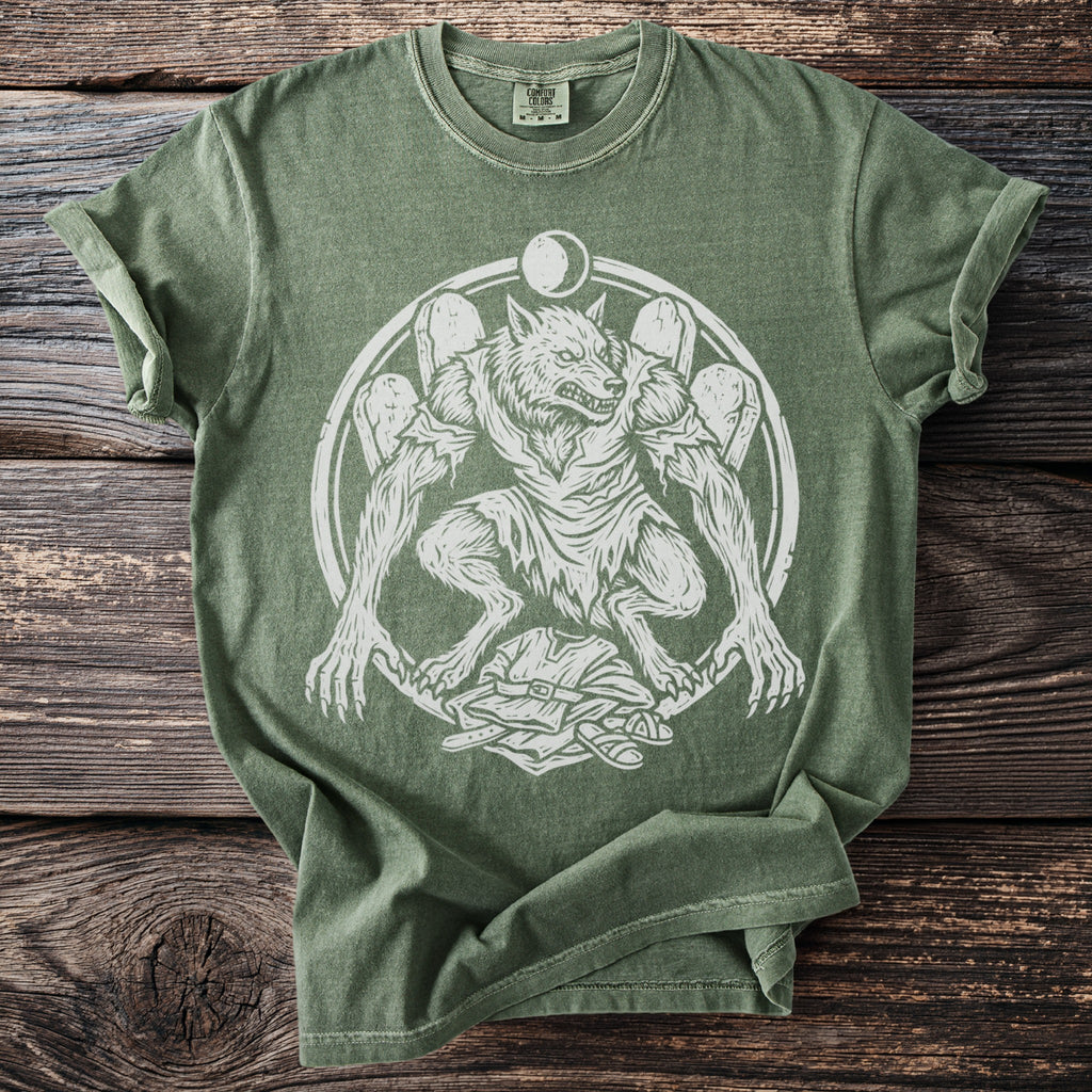 Green t-shirt with white werewolf graphic and moon emblem.