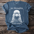 Blue t-shirt with a pigeon graphic and text "no thoughts head empty".