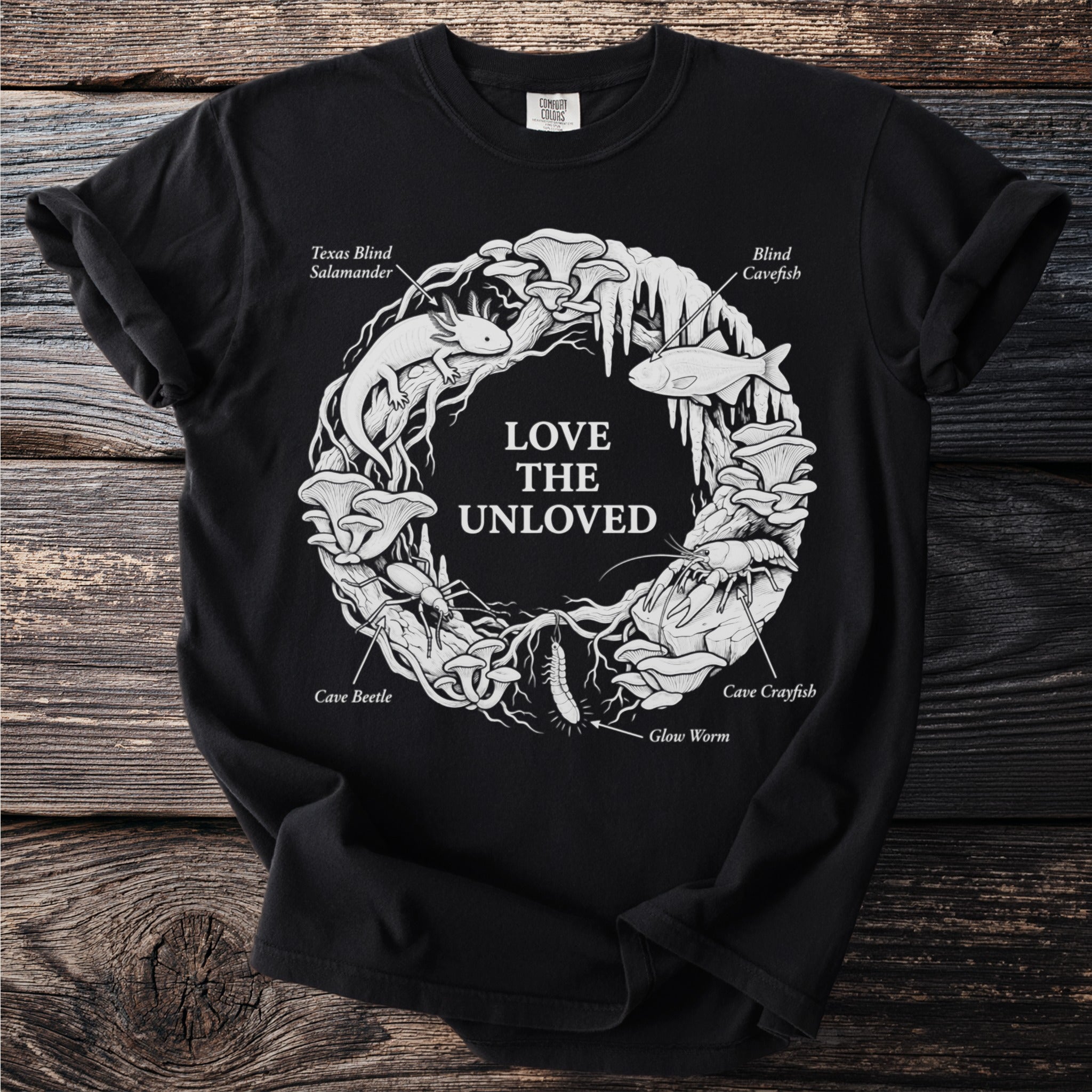 Black t-shirt with white graphic of cave creatures: salamander, fish, crawfish, beetle, glow worm, and mushrooms.
