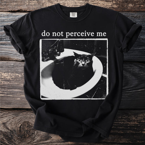 Black t-shirt with text "do not perceive me" and a distressed image of a black cat in a sink.