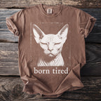 Brown t-shirt with a distressed print of a Sphynx cat and text "born tired".